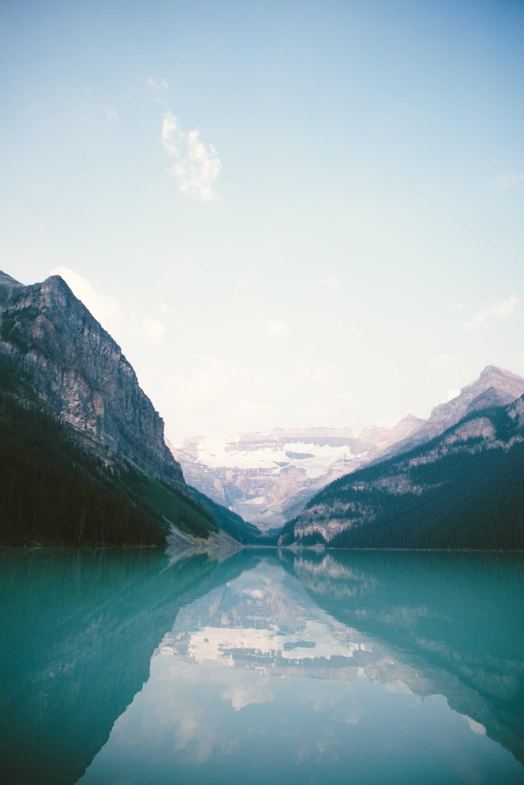 Glacial lake surrounded by soaring mountains.